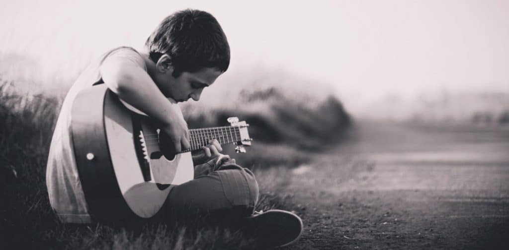 Young boy playing guitar