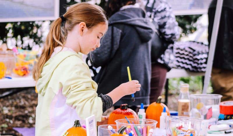 Girl with paints and art crafts