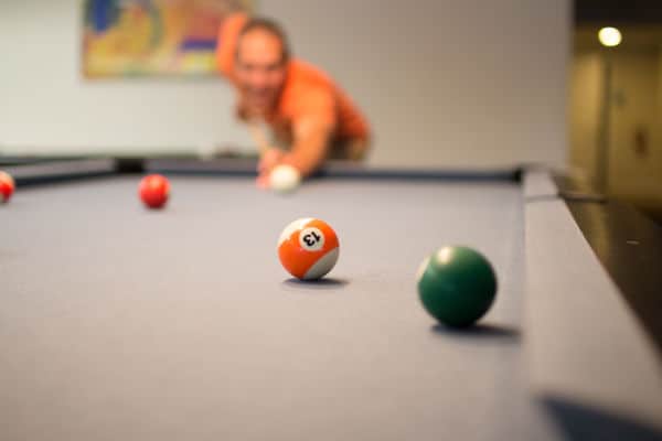 Pool player about to take a shot